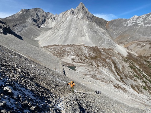 Climbing back to the col in cold wind