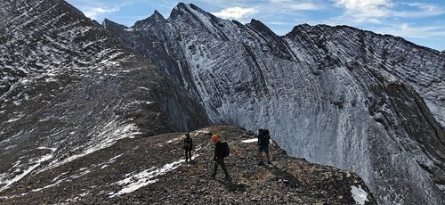 Happy to retreat from the col down to the valley, and out of the wind that greeted us there