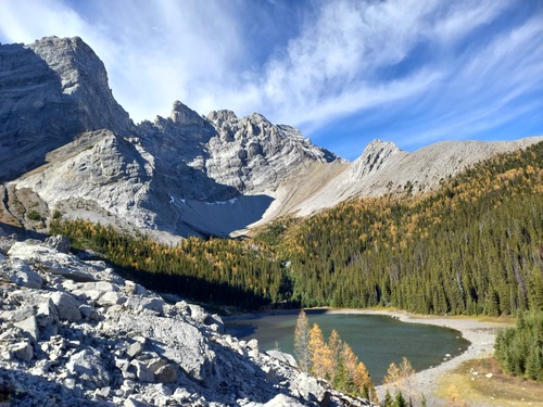 The upper lake under the impressive cliffs of Tombstone mountain 