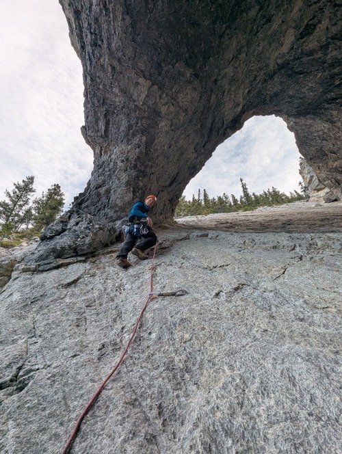 Sebastiaan sets out leading the next 5.5 'crux' pitch through the arch - the grade partly due to the angle rather than lots of big positive holds...