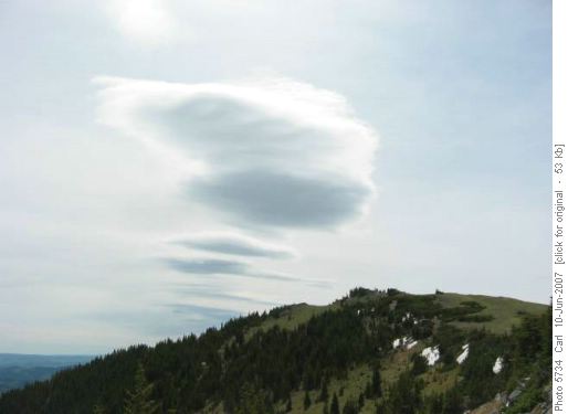 Lenticular clouds betray strong winds aloft