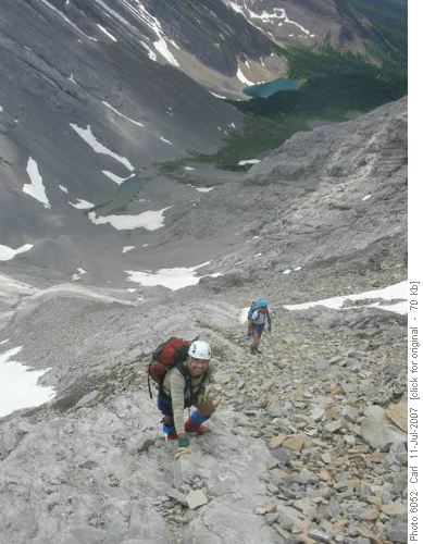 Climbing the long slabby/scree slope to The Tower (Rummel Lake in the background)