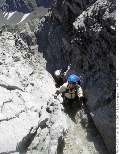 Easy scrambling up the final pitch to the summit ridge