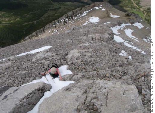Janet exploring snow filled rock cracks on the west outlier Janet exploring snow filled rock cracks on the west outlier