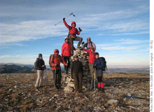 Group climbing summit cairn of Mount Livingstone